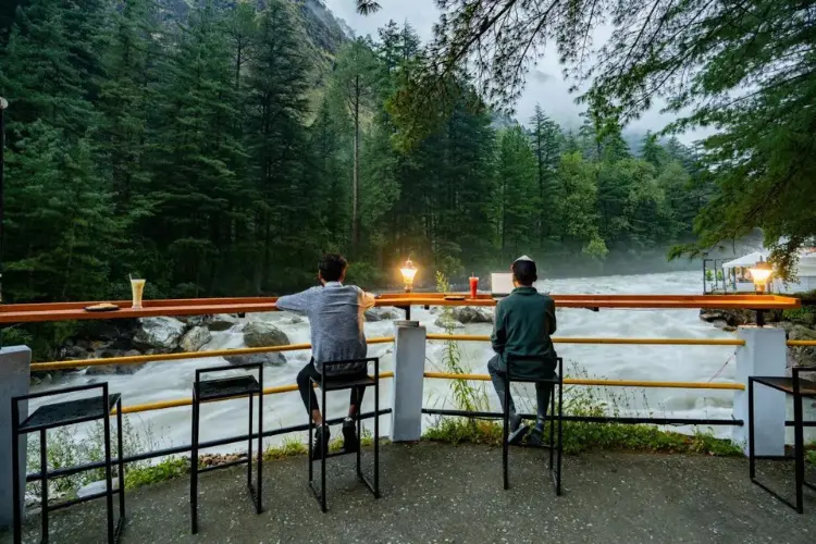 2 man sitting at river side