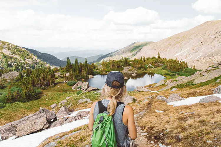 woman looking over mountains